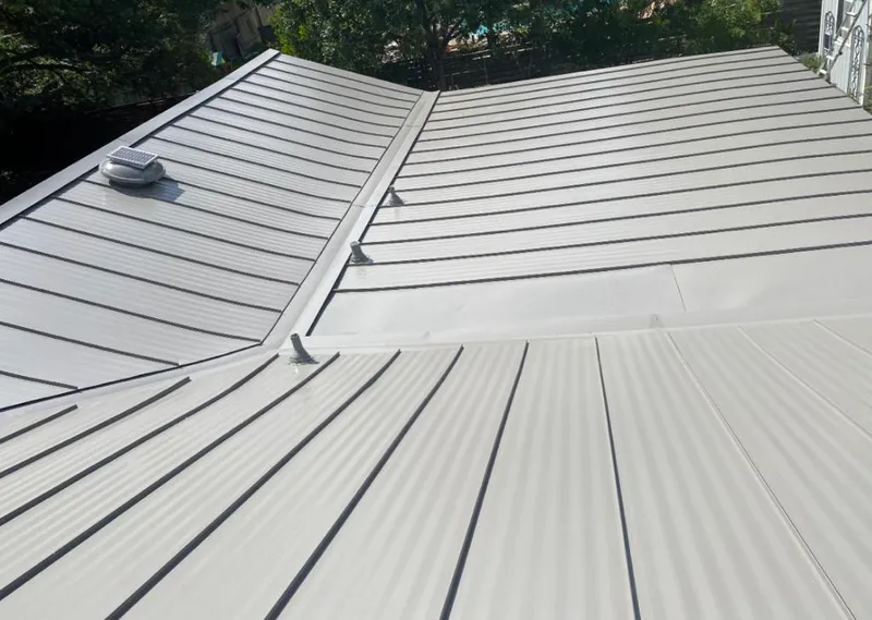 Solar attic fan installed on a metal roof for Roof Ventilation in Moscow